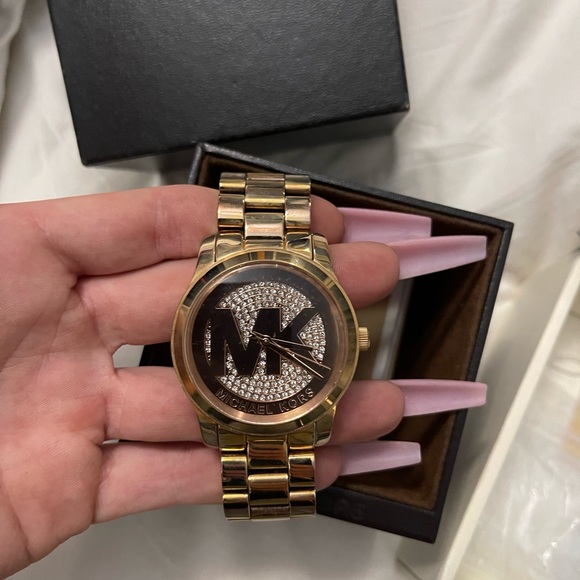 Woman’s Michael Kors watch with matching bracelet